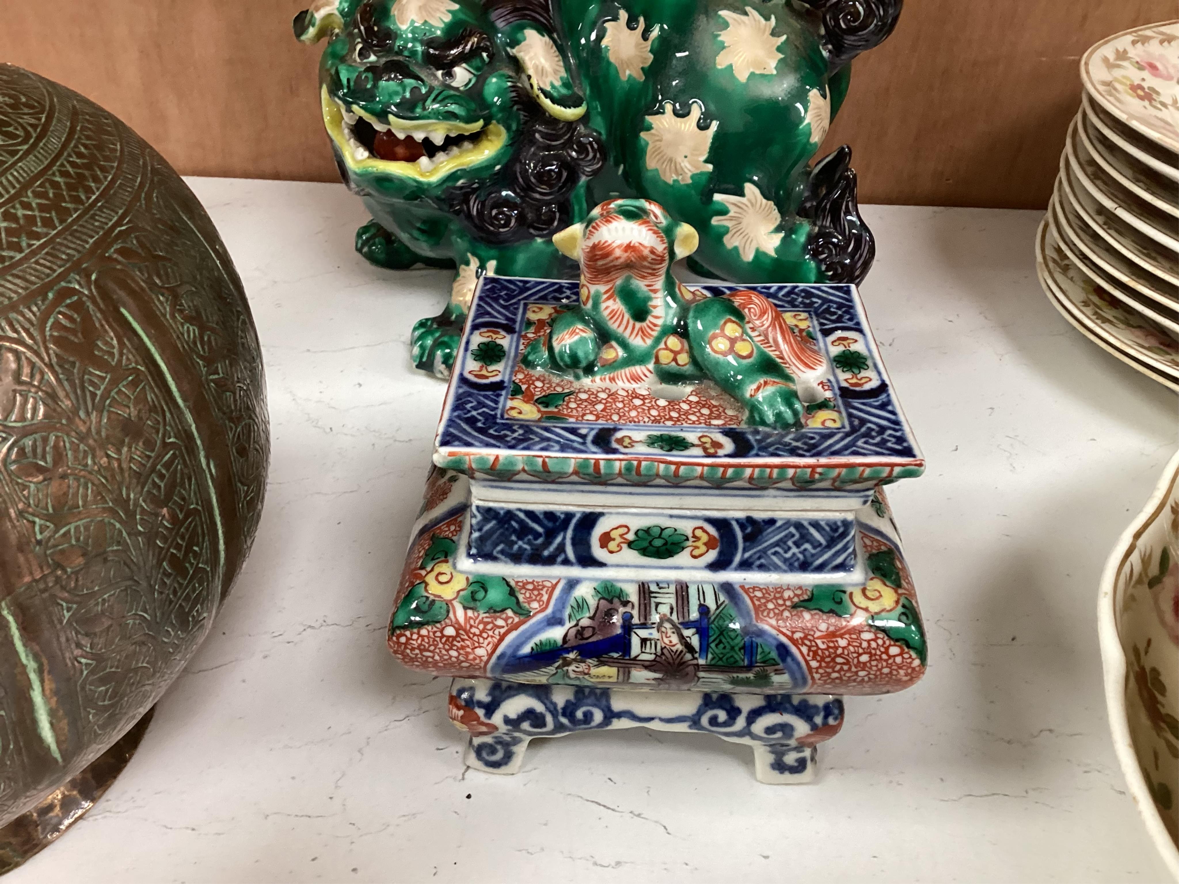 A Japanese Dog of Fo, a box and cover figure and blue and white pourer, Dog of Fo, 25cm high
